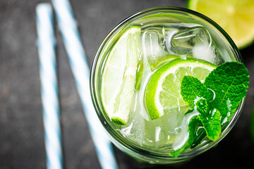 Traditional mojito with pieces of lime and mint. 