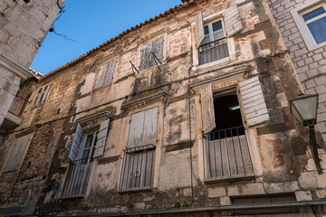 Fototapeta na wymiar Ancient building facade in the Old City of Trogir, Croatia