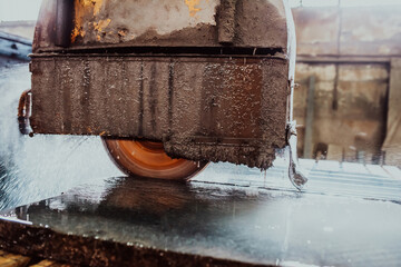 A stone cutter processes stone and granite slabs in the industry