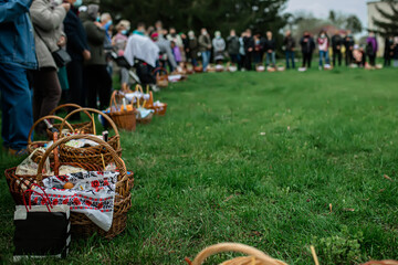 Parishioners of the church at the church service on the day of the right-wing Easter with baskets of food in anticipation of the consecration of Easter cakes and eggs.