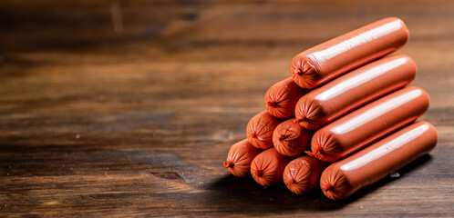 A mountain of sausages on the table. 