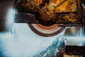 A stone cutter processes stone and granite slabs in the industry