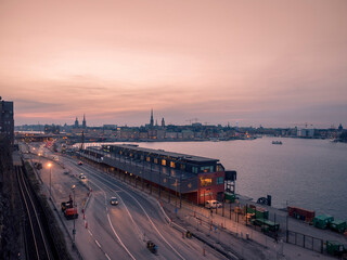 Aerial view of Stockholm at night with pink sunset.