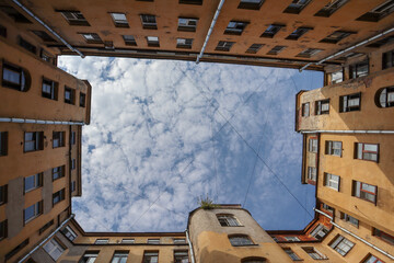 piece of the blue sky with clouds in iconic famous yard-well in Saint Petersburg, Russia