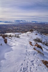 Maack Hill Sensei hiking trail views in snowy mountains, Lone Peak Wilderness Wasatch Rocky Mountains, Utah. USA. 