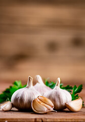 Cloves of fresh garlic with parsley. 
