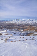 Fototapeta na wymiar Maack Hill Sensei trail snowy mountain valley views in Lone Peak Wilderness Wasatch Rocky Mountains, Utah. USA. 