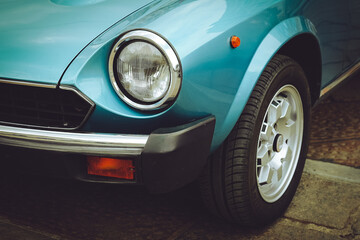 Obraz na płótnie Canvas Close-up of headlights of red vintage car.