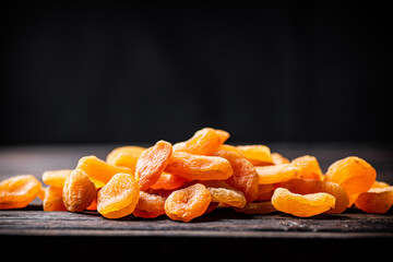 A bunch of dried apricots on the table. 