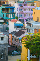 Fototapeta premium Telephoto view of congested multi coloured buildings of various heights at Hue in Vietnam