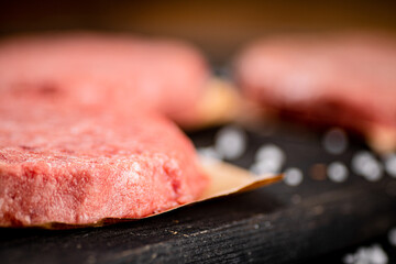 Fresh raw burger on the table. 