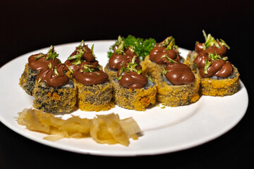 Hot Roll Sushi Pieces with Black Background 