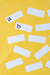 adhesive white paper stickers or labels and the letters a and b