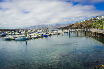 Boats moored in the harbour and Marina in Puerto del Carmen, Lanzarote.