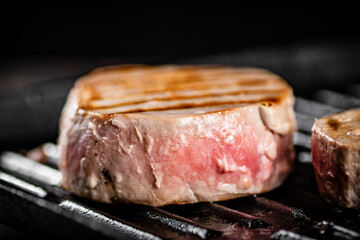 Tuna steak in a grill pan. 