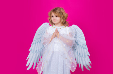 Valentines day. Little cupid angel child with wings with prayer hands, hope and pray concept....