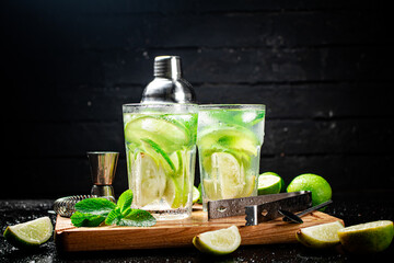 Mojito with pieces of lime and mint leaves. 