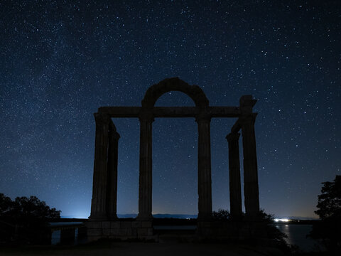 Night landscape with ancient Roman portico known as Los Marmoles. Extremadura. Spain.