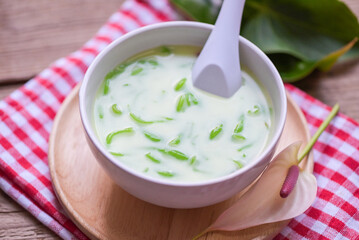 Thai dessert - Thai rice flour pandan leaf with coconut milk and syrup sweets dessert on white bowl, Asian food