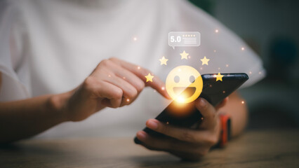 hand touching on five star icon and happy smile face for feedback review satisfaction service, Customer service experience and business satisfaction survey.