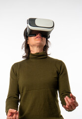 woman with virtual reality goggles looking up, white background, vertical photography
