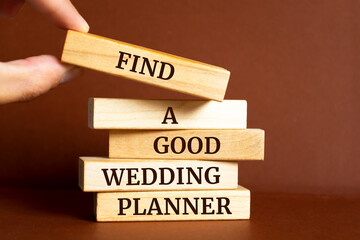 Wooden blocks with words 'FIND A GOOD WEDDING PLANNER'.