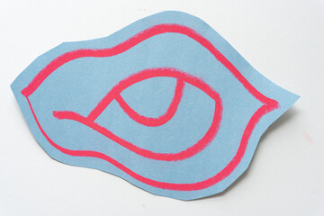 blue gray construction paper shape with abstract red/pink outlines