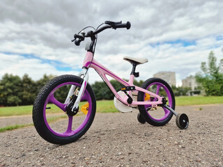 Girls bicycle outside during summer