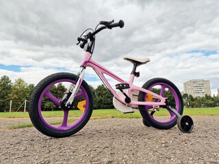 Girls bicycle outside during summer