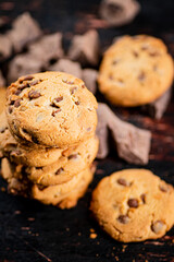 Cookies with pieces of milk chocolate on the table. 