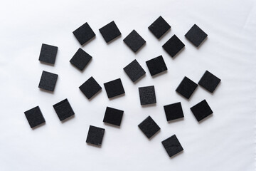 Fototapeta na wymiar group of grungy wood tiles painted black on white paper