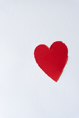 Naklejka na ściany i meble paper heart with ripped edge on blank white paper