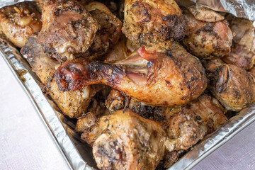 grilled chicken thighs ready to eat at a party