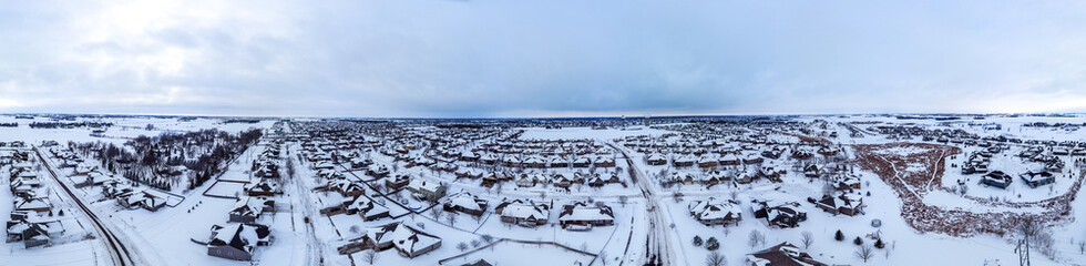 Fototapeta na wymiar Panoramic drone aerial photo of the south side of Sioux Falls, South Dakota during the winter after a snow storm.
