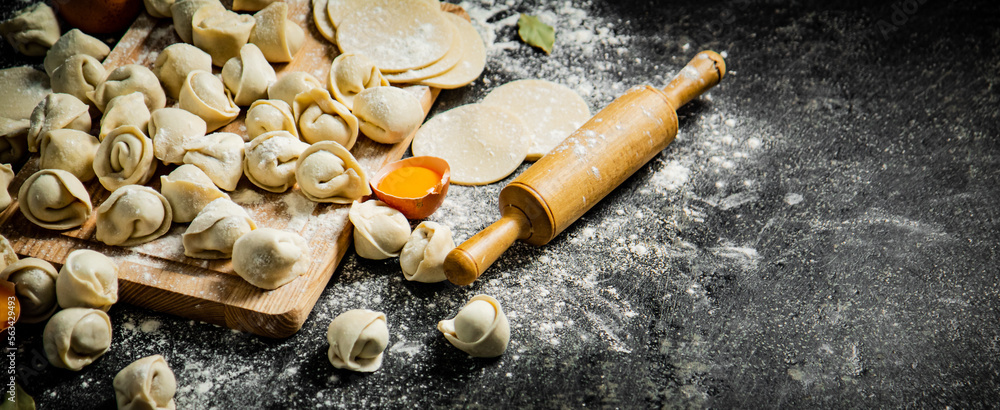 Sticker making homemade dumplings. on a black background.