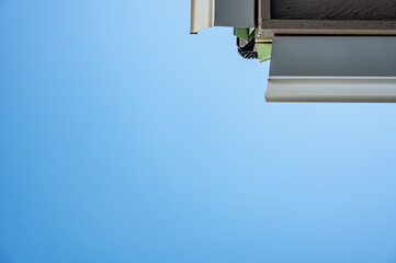 Metal gutters be installed on a residential buildings with two sections coming together for a 90 degree connection. 