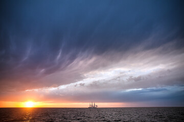 Square three-master at sunset, before the storm