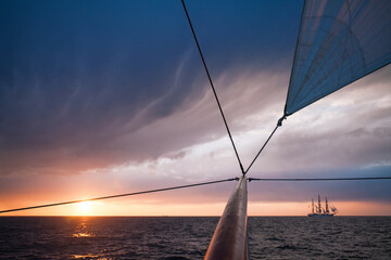 Square three-master at sunset, before the storm