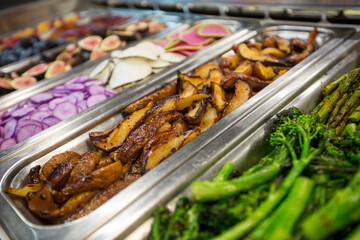 Roasted pears with balsamic vinegar and honey at a food and salad bar