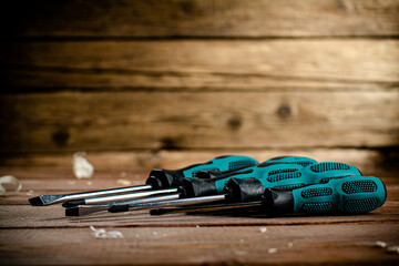 Manual screwdrivers on the table. 