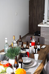 Table full of bottles and plastics, After party chaos concept.