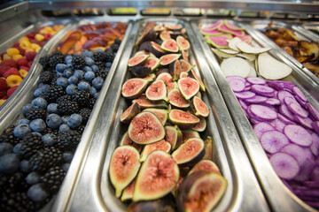 Close-up of White Sierra Figs with Fruits and Vegetables at a Salad Bar