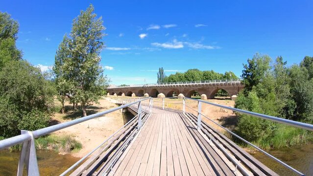walkway bridge over Porma river in Puente Villarente, Municipality of Villaturiel, province of Leon, Castile and Leon, Spain