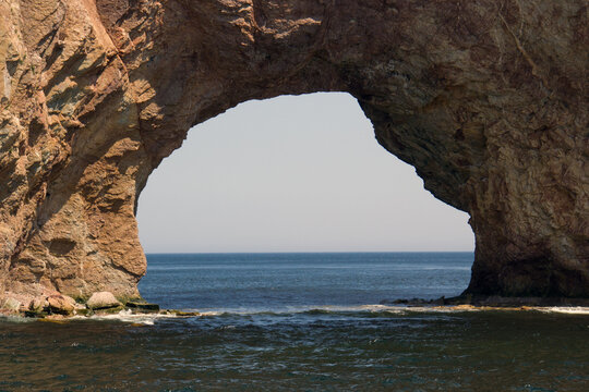 Amazing landscape of Roch&eacute; Perc&eacute; ; A hole in the ocean ; Hole in th big rock