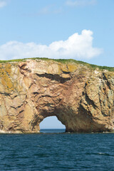Roché Percé, a natural hole in a huge rock in the ocean