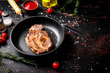 Frying pan with grilled steak. 