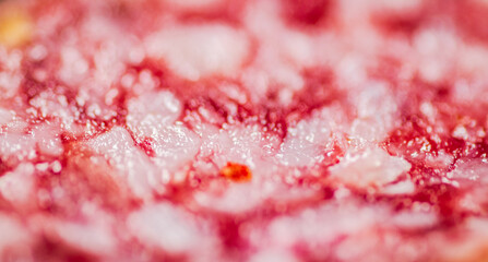 Cut of salami sausage. Macro background. 