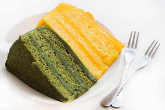 orange, green tea cake dessert snace delicious arrangement flat lay style on background white 