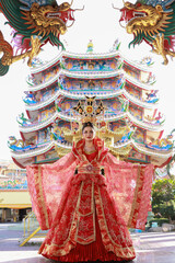 Obraz premium Chinese new year , Portrait young asian woman with traditional red Chinese hong hao cheongsam qipao costume, Beautiful woman wearing red qipao on Chinese new year