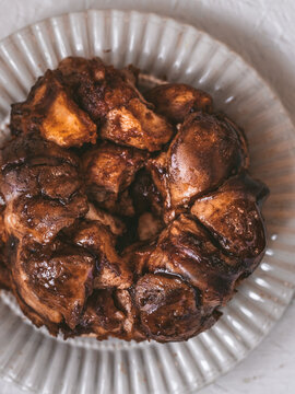 pumpkin flavored monkey bread on a white serving dish